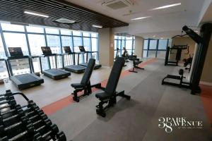 a gym with treadmills and elliptical machines at LUXURY CONDO STUDIO UNIT at 38 PARK AVENUE CEBU I T PARK in Tabok