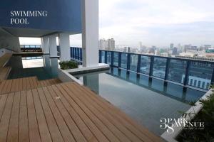 a swimming pool on the roof of a building at LUXURY CONDO STUDIO UNIT at 38 PARK AVENUE CEBU I T PARK in Tabok