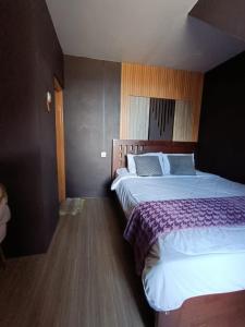 Postel nebo postele na pokoji v ubytování Oryza villa