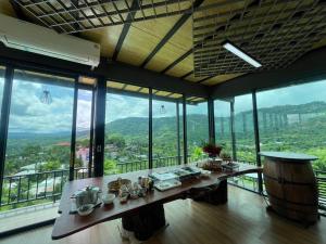 a dining room with a table with dishes on it at บ้านผูกรัก ทะเลหมอก ณ เขาค้อ in Khao Kho