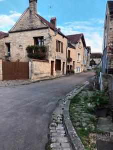 an empty street in an old stone building at La petite maison in Noyers