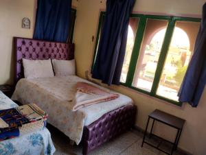 Postel nebo postele na pokoji v ubytování hôtel oasis tinghir