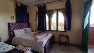 Postel nebo postele na pokoji v ubytování hôtel oasis tinghir
