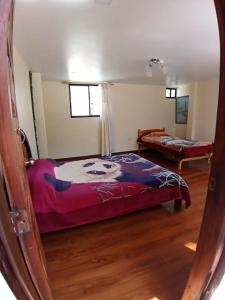 Voodi või voodid majutusasutuse Hostal Atlantis toas