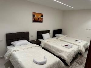 Voodi või voodid majutusasutuse Sun 3 Pyramids Inn toas