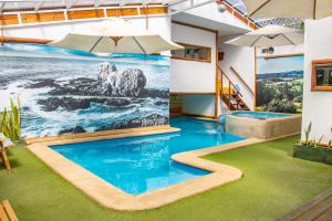 Bazén v ubytování Rustika Pichilemu Apart Hotel Piscina Temperada Hidromasaje nebo v jeho okolí