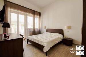 Tempat tidur dalam kamar di La Perla del Mare di Polignano Apartments