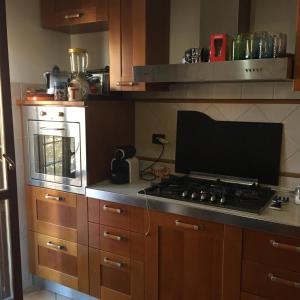 a kitchen with a stove and a stove top oven at Casa Antonella in Rome