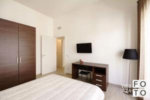 Кровать или кровати в номере La Perla del Mare di Polignano Apartments