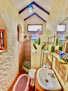 a bathroom with a sink and a toilet at Casa del Lago Lodging House in Puerto Ayora +131 photos