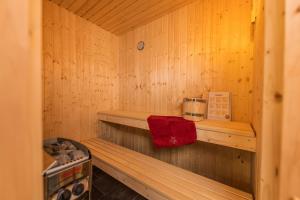 a wooden sauna with a coffee maker on a shelf at Lee - Nordhorn in Nordhorn