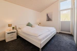 Ένα ή περισσότερα κρεβάτια σε δωμάτιο στο Windrose - Nordhorn +17 φωτογραφίες
