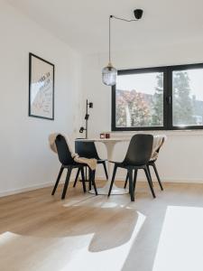 a dining room with a table and two chairs at Ferienwohnung Soest in Soest +28 photos