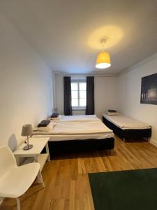 Ένα ή περισσότερα κρεβάτια σε δωμάτιο στο Home Inn RSG19
