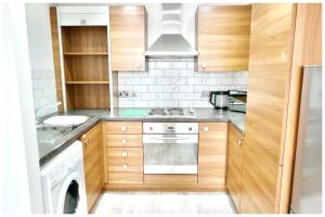 Kuchyň nebo kuchyňský kout v ubytování Modern Manchester City Centre Apartment + 3 fotografie