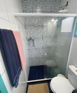a shower with a glass door in a bathroom at Recanto dos Valles in Búzios