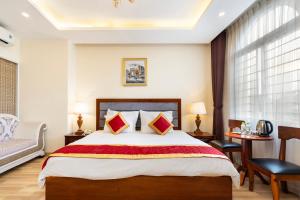 Postel nebo postele na pokoji v ubytování Kadupul Hotel