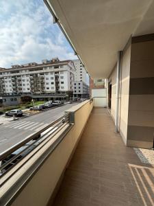 a balcony of a building with a view of a street at Ales apartment in Cuneo