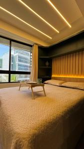 Postel nebo postele na pokoji v ubytování 403 belíssimo Studio no cabo branco