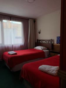 Postel nebo postele na pokoji v ubytování Hotel Condor de Plata + 8 fotografií