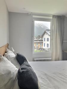 Postel nebo postele na pokoji v ubytování Magnifique Appartement au Centre de Chamonix
