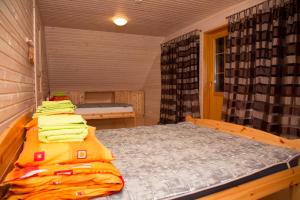 Voodi või voodid majutusasutuse Väike-Pärna Holiday Home toas