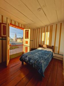 Postel nebo postele na pokoji v ubytování Hostal Casa Celeste + 37 fotografií
