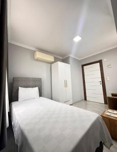 Postel nebo postele na pokoji v ubytování Renaissance Apart Hotel