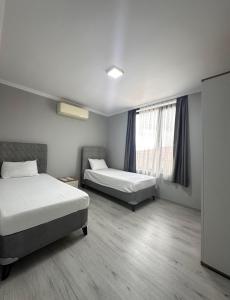 Postel nebo postele na pokoji v ubytování Renaissance Apart Hotel