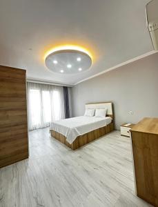 Postel nebo postele na pokoji v ubytování Renaissance Apart Hotel