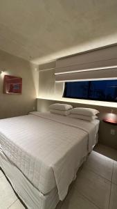 Postel nebo postele na pokoji v ubytování Loft 2 Edf celita Franca Business e flat