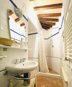 a bathroom with a sink and a shower at Spello House Altana in Spello