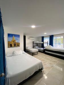Postel nebo postele na pokoji v ubytování Blue Diamond House