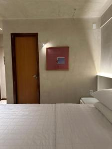 Postel nebo postele na pokoji v ubytování Loft 2 Edf celita Franca Business e flat