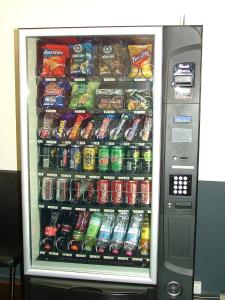 a vending machine filled with lots of soda and sodas at Miami Hotel Melbourne in Melbourne