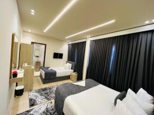 Letto o letti in una camera di Golden Scarab Pyramids Hotel
