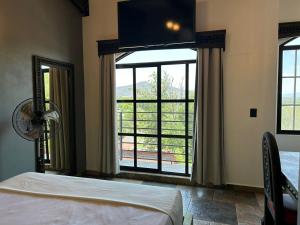 Postel nebo postele na pokoji v ubytování Hotel Villas Camargo