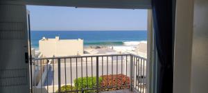 a view of the ocean from the balcony of a condo at Sunseaker- Beachfront Complex in Ballito