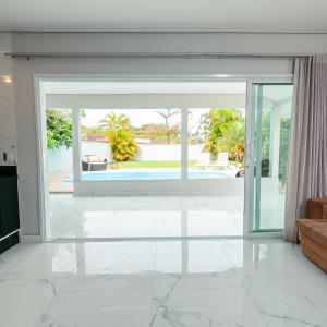 Posezení v ubytování M&M House - Casa com Piscina e Ar Condicionado em Matinhos