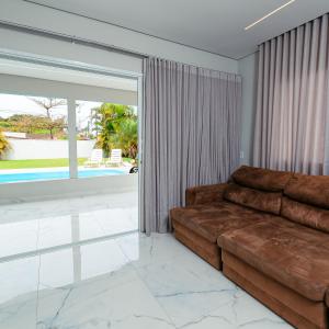 Posezení v ubytování M&M House - Casa com Piscina e Ar Condicionado em Matinhos