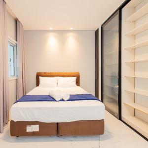 Postel nebo postele na pokoji v ubytování M&M House - Casa com Piscina e Ar Condicionado em Matinhos