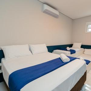 Postel nebo postele na pokoji v ubytování M&M House - Casa com Piscina e Ar Condicionado em Matinhos