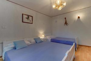 Postel nebo postele na pokoji v ubytování Apartment Carmen