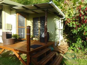 a wooden deck in front of a house at The Studio at Gingerbread in Savusavu