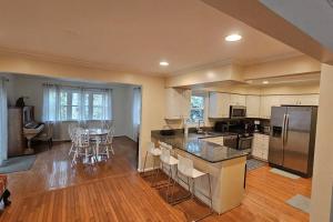 a large kitchen with a table and chairs in it at Charming Retreat at Silver Spring in Silver Spring