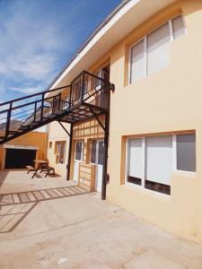 a staircase on the side of a building at Rincón Patagónico in Esquel