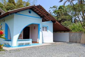 a blue and white house with a garage at Blaues Haus 2 in Pomerode