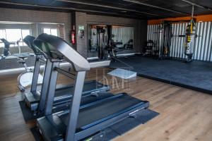 a gym with a treadmill and other exercise equipment at Studio Completo a Beira Mar, Grand Smart Residence in Aracaju