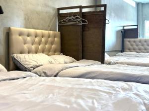 Ein Bett oder Betten in einem Zimmer der Unterkunft Nonoteru Chiangmai