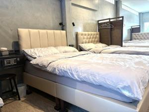 Ein Bett oder Betten in einem Zimmer der Unterkunft Nonoteru Chiangmai
